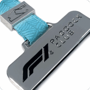 Custom metal VIP badge with blue lanyard attachment — premium motorsport credential for paddock and team access